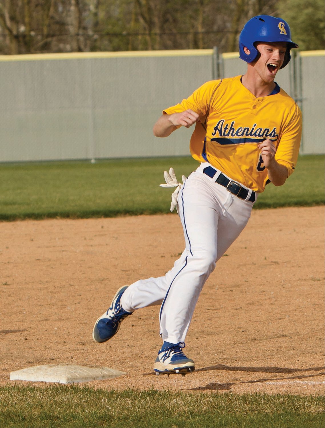 Crawfordsville's Andrew Martin shows excitement rounding third base on Tuesday night at Southmont.