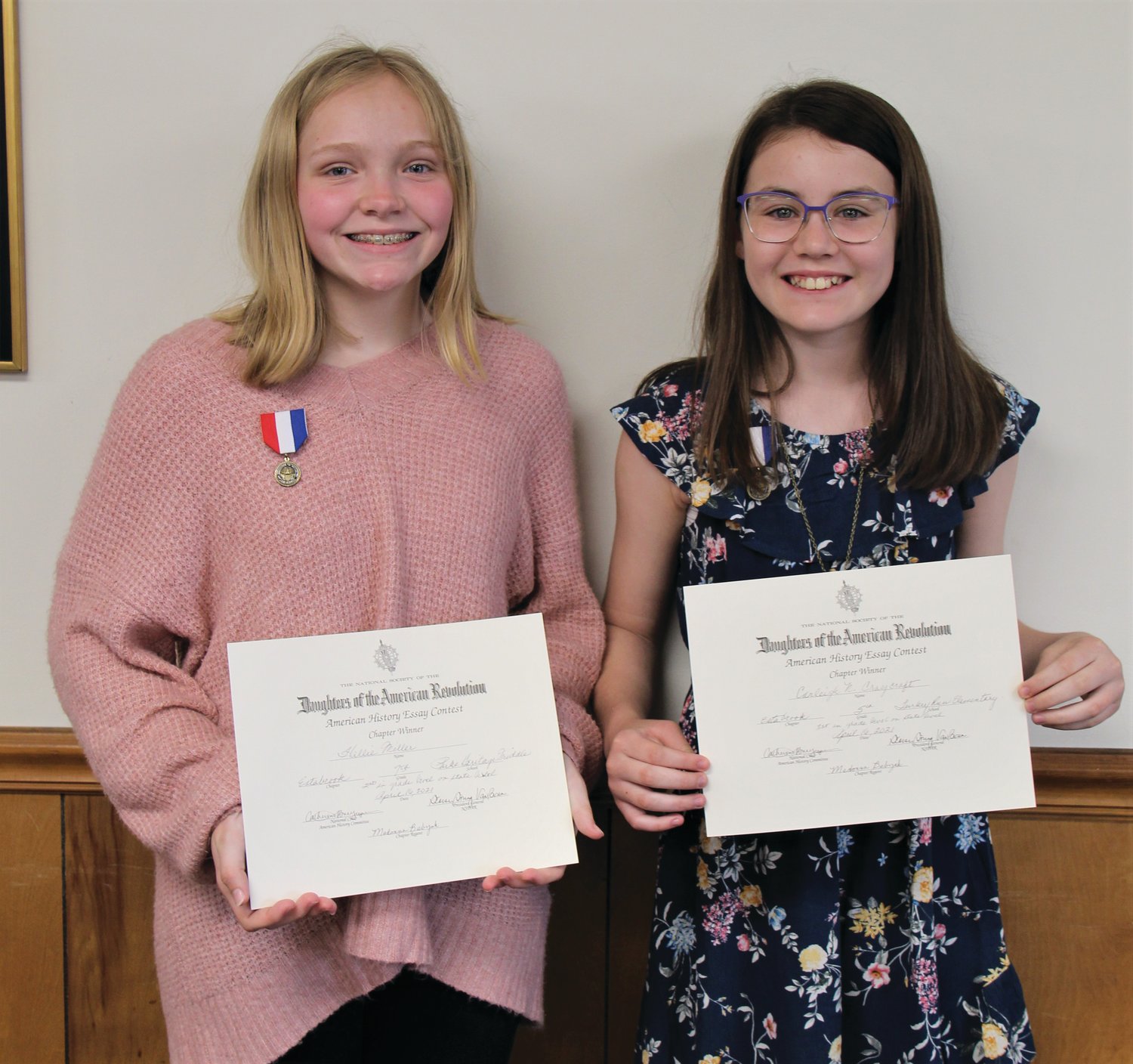 The members of the Daughters of the American Revolution organization recognized the winners of their essay contest and their Good Citizen in a special ceremony held April 16 at the Parke County fairgrounds meeting room. Grade winners in the essay contest were fifth grade, Carleigh Craycraft of Turkey Run Elementary and seventh grade, Hallie Miller of Parke Heritage Middle School. Craycraft’s essay placed first at the state level and Miller’s placed second. The essay topic was ”The Boston Massacre.” Jillian Gregg, Parke Heritage High School senior, was also recognized for being selected as the PHHS Good Citizen Award Winner. She was named the county winner. Hallie is the daughter of Matt and Melanie Miller of Tangier, Carleigh is the daughter of Brad and Danika Craycraft of Bloomingdale and Jillian is the daughter of Brad and Samantha Gregg of Marshall. Pictured are Miller, left, and Craycraft. Not pictured is Gregg.