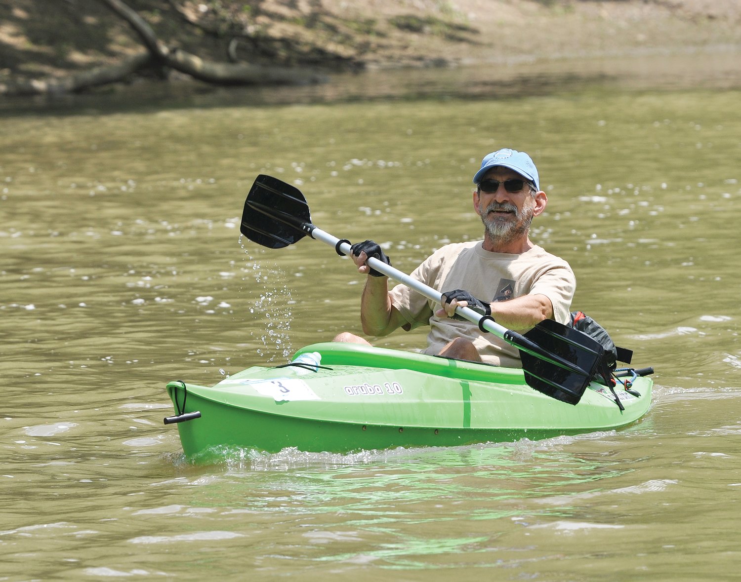 A kayaker races in the Friends of Sugar Creek Canoe Race in 2018. The event is scheduled to return May 15 after a two-year absence.
