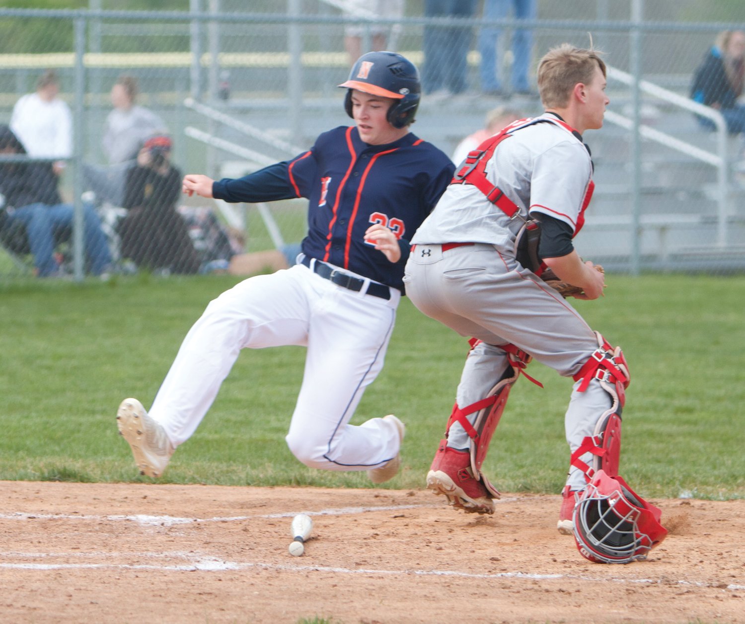 North Montgomery's Brookes Walters slides into the home plate on Saturday at Southmont.