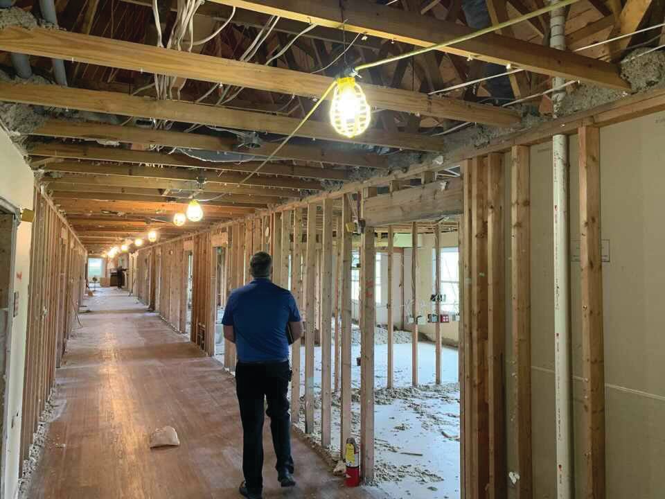 Marc Bonwell, Montgomery County building and zoning administrator, walks through the future Montgomery County Annex. The former Williamsburg Health Care facility is being renovated into county offices and a government meeting space.