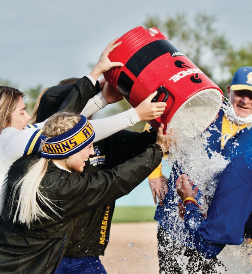 The Athenians got coach Kellerman with the water cooler to help celebrate their first win of the season.