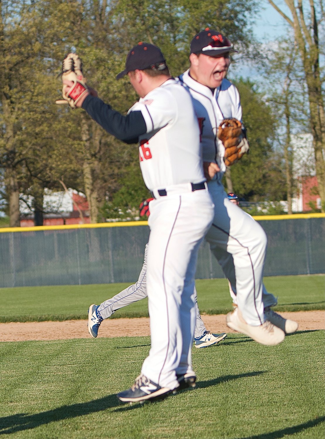 North Montgomery's Austin Sulc celebrates with Nick Norman after Sulc helped turn a double-play.