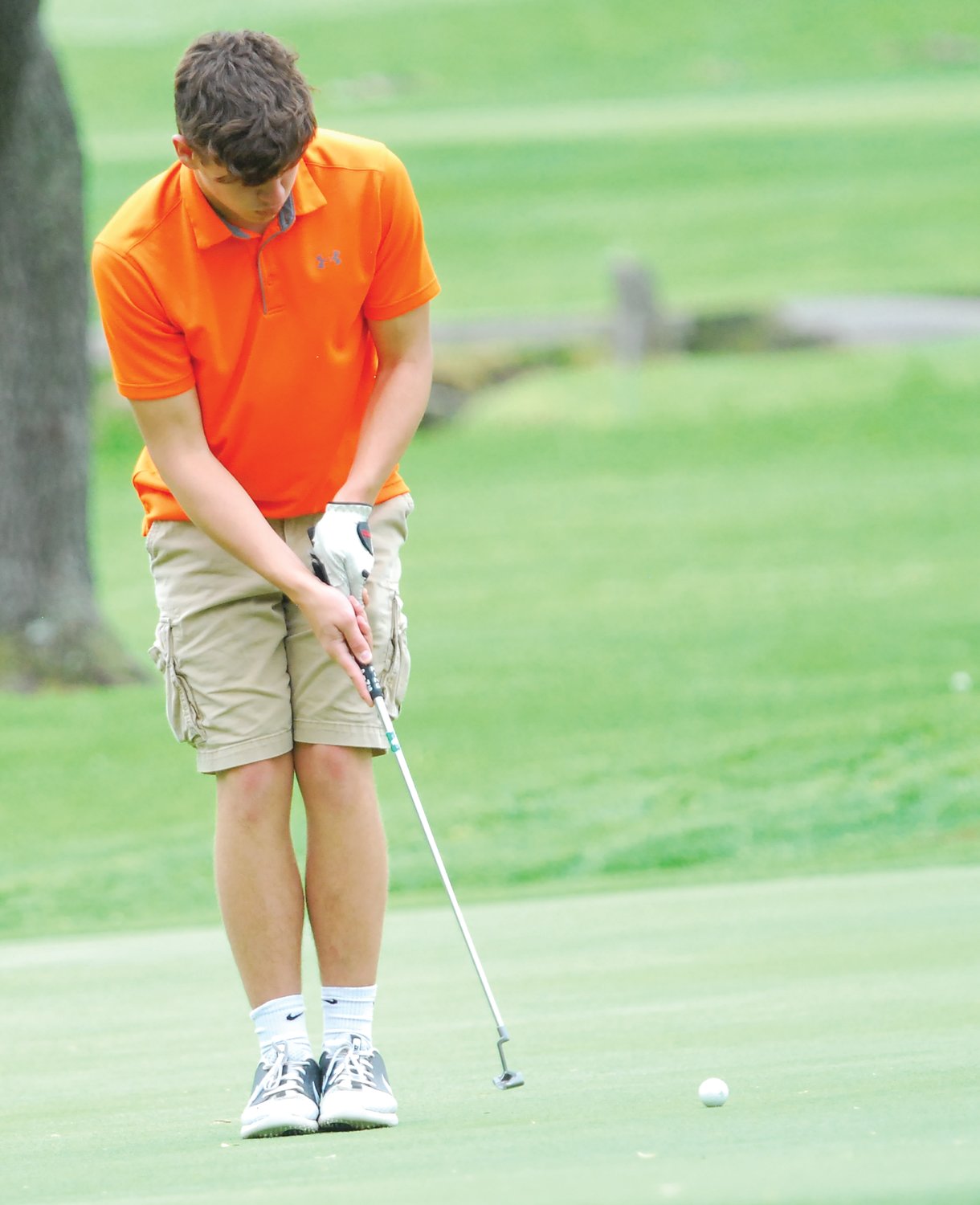 North Montgomery's Drew Norman putts for the Chargers at the Sagamore Conference meet on Saturday.