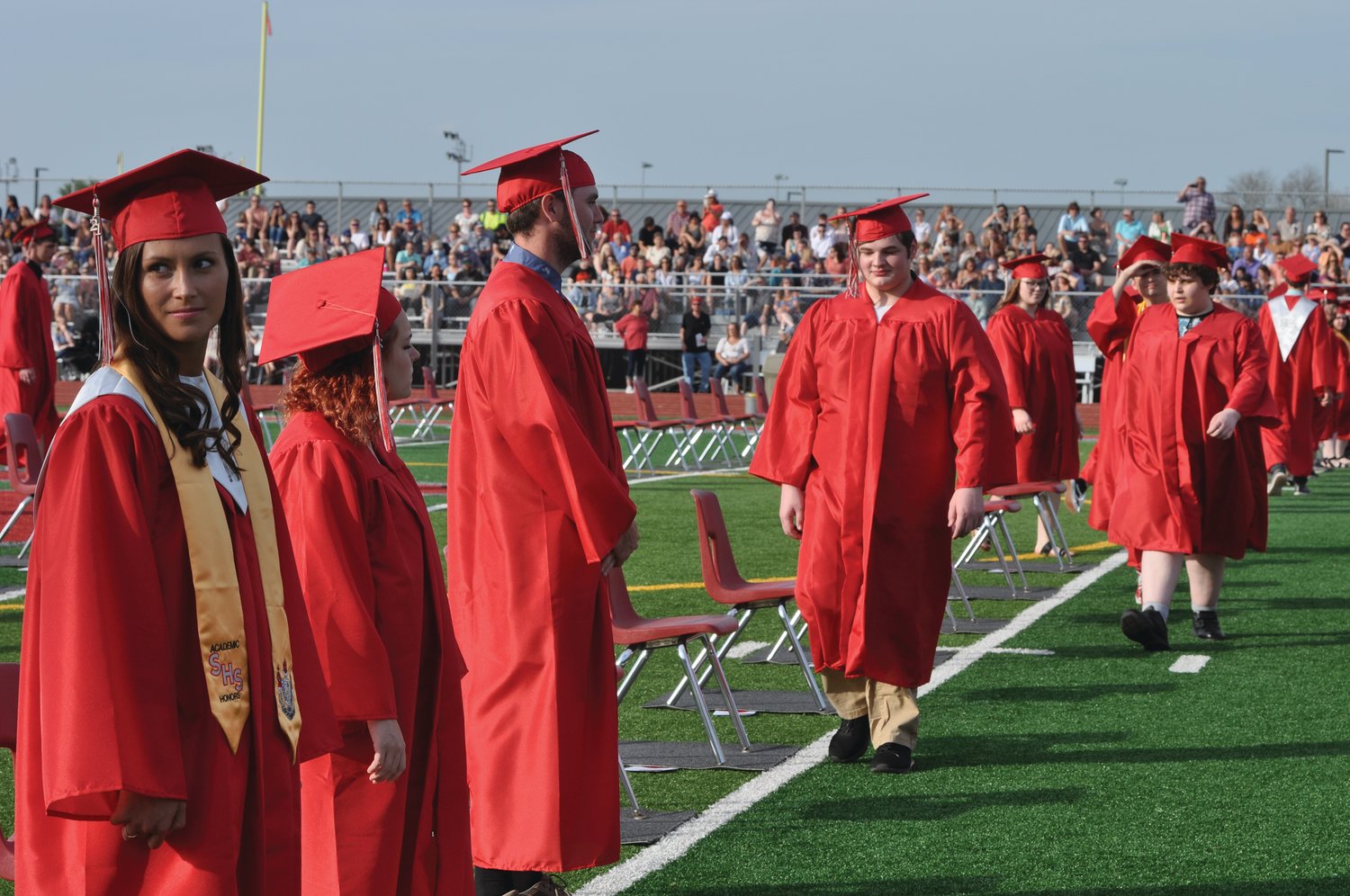 Soon-to-be-graduates file into Mountie Stadium for commencement exercises at Southmont High School on Friday.