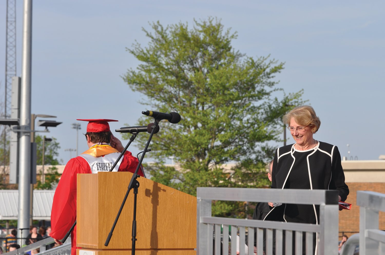 Retired Southmont High School teacher Jane Steiner approaches the podium as Class of 2021 president Riley Woodall leaves the stage during commencement exercises at Southmont High School on Friday.