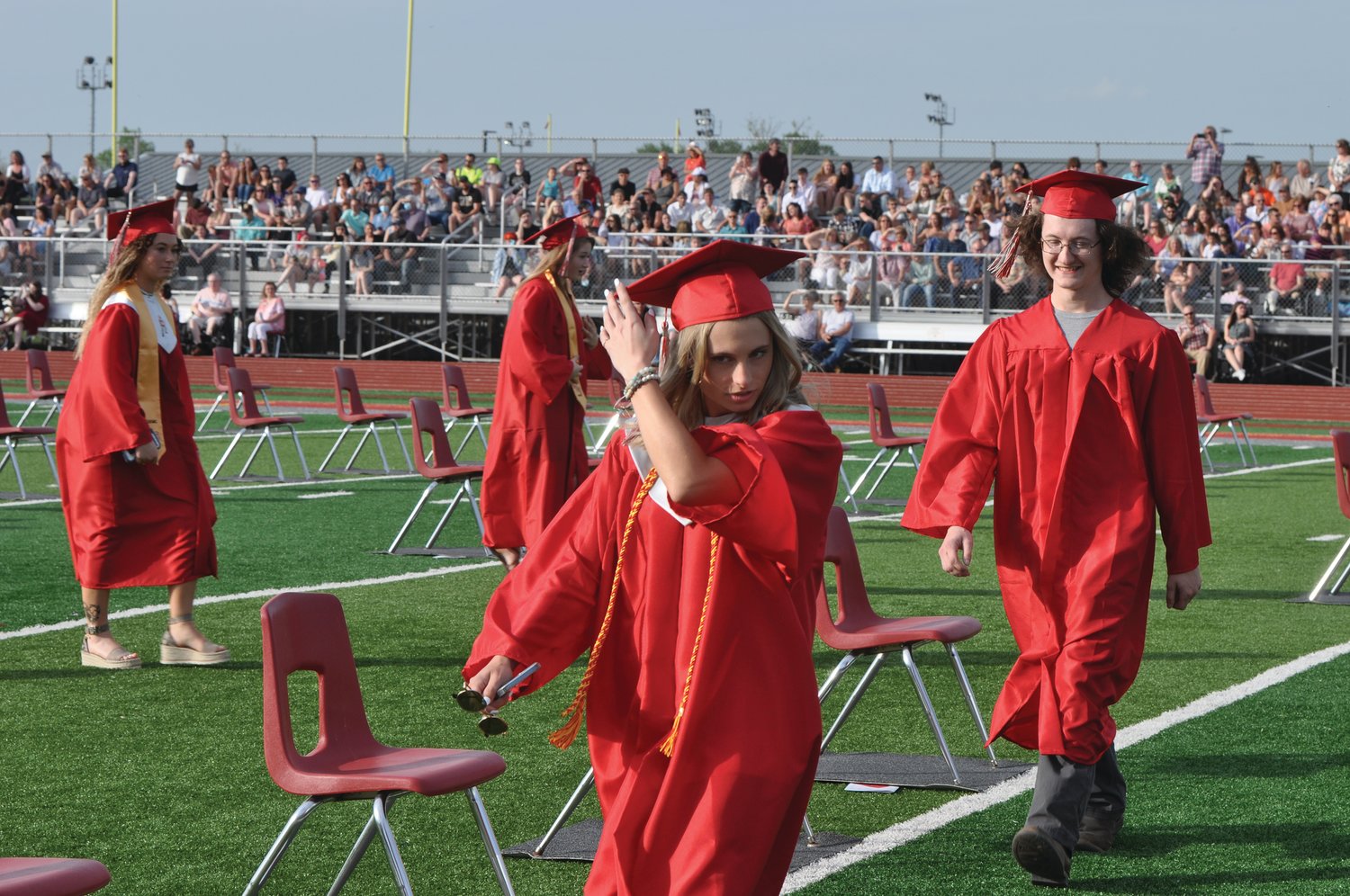 A soon-to-be-graduate adjusts her cap during commencement exercises at Southmont High School on Friday.