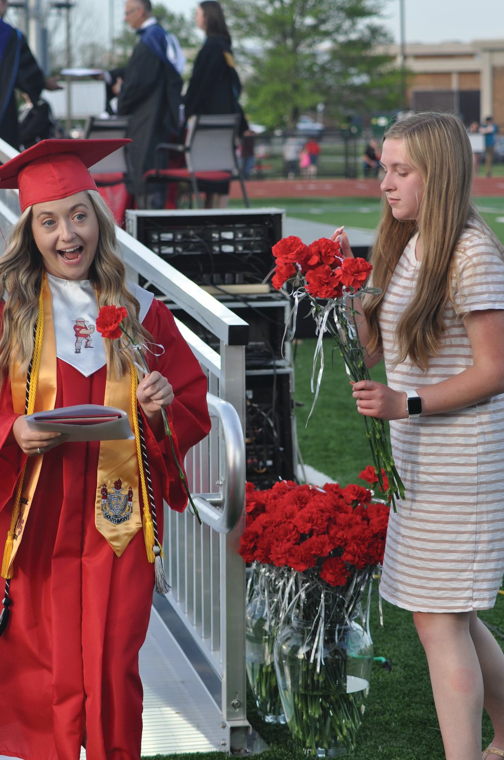 Maddy Murphy celebrates after accepting her diploma during commencement exercises at Southmont High School on Friday.