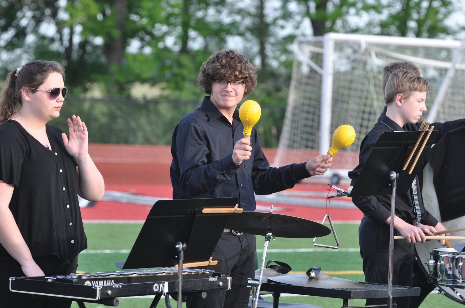 A member of the Royal Mountie Band shakes maracas during commencement exercises at Southmont High School on Friday.