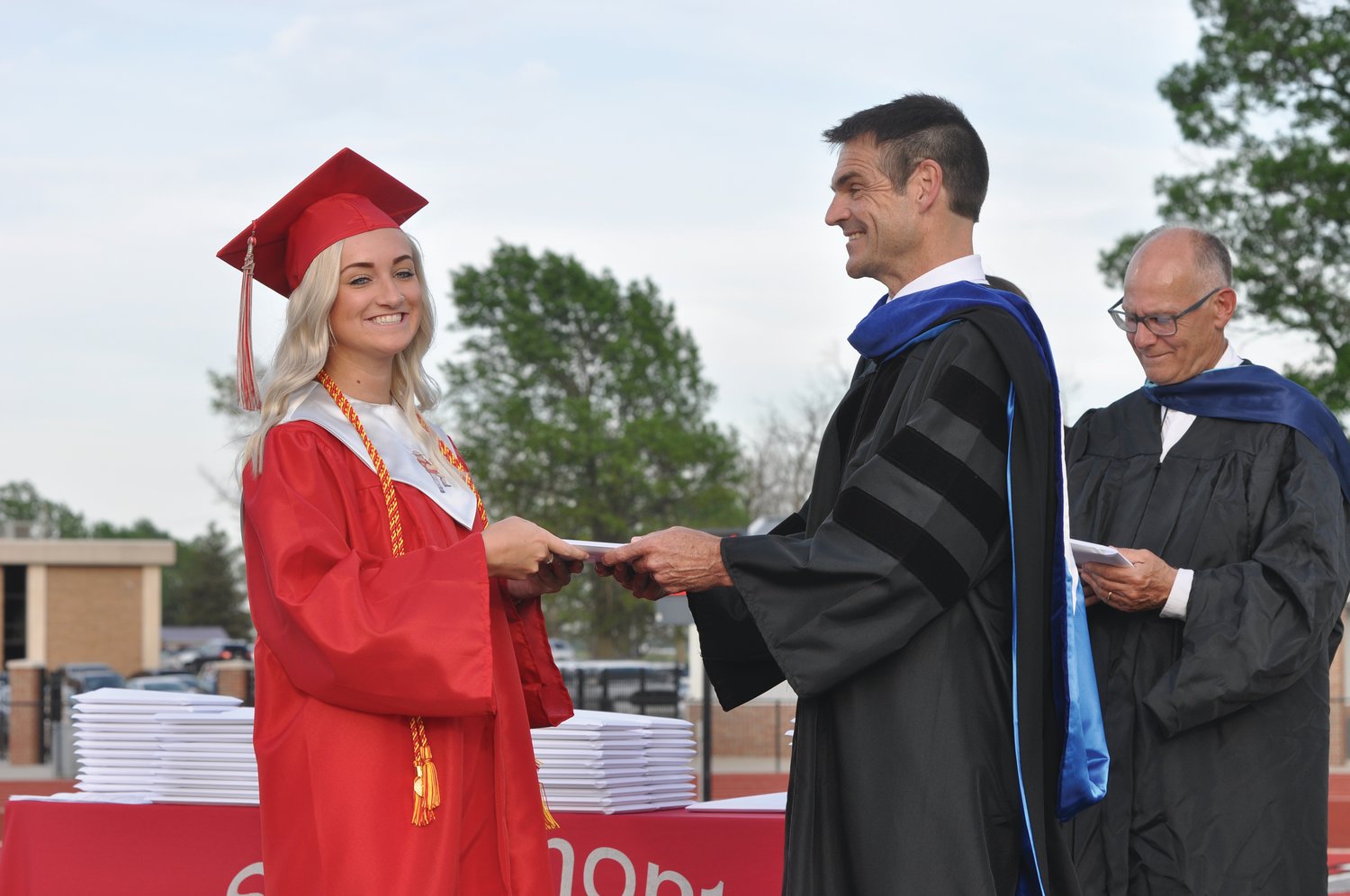 Olivia Bobenmoyer accepts her diploma from superintendent Dr. Shawn Greiner during commencement exercises at Southmont High School on Friday.