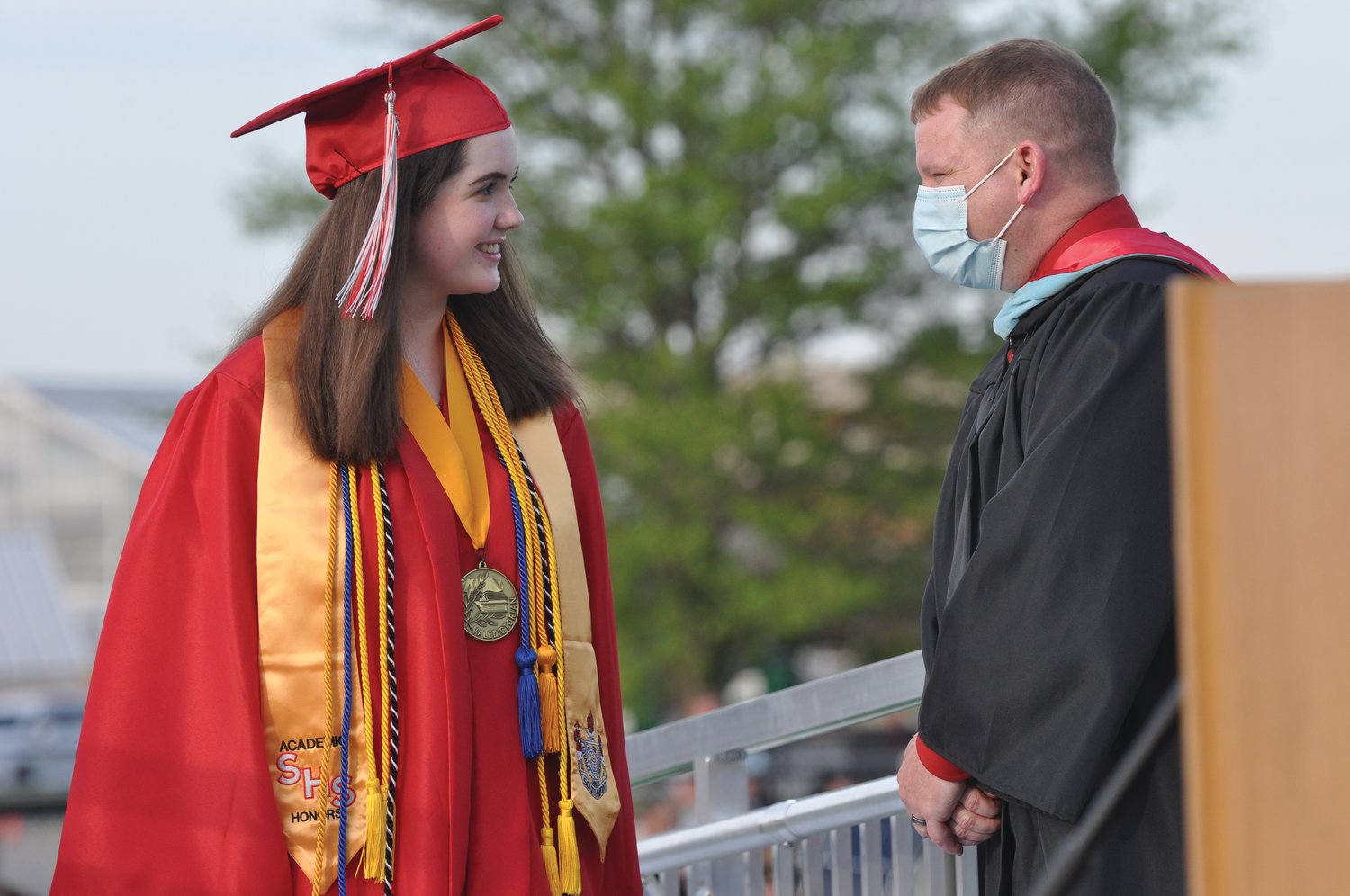 Valedictorian Madison Livesay chats with teacher Reasley Thompson during commencement exercises at Southmont High School on Friday.