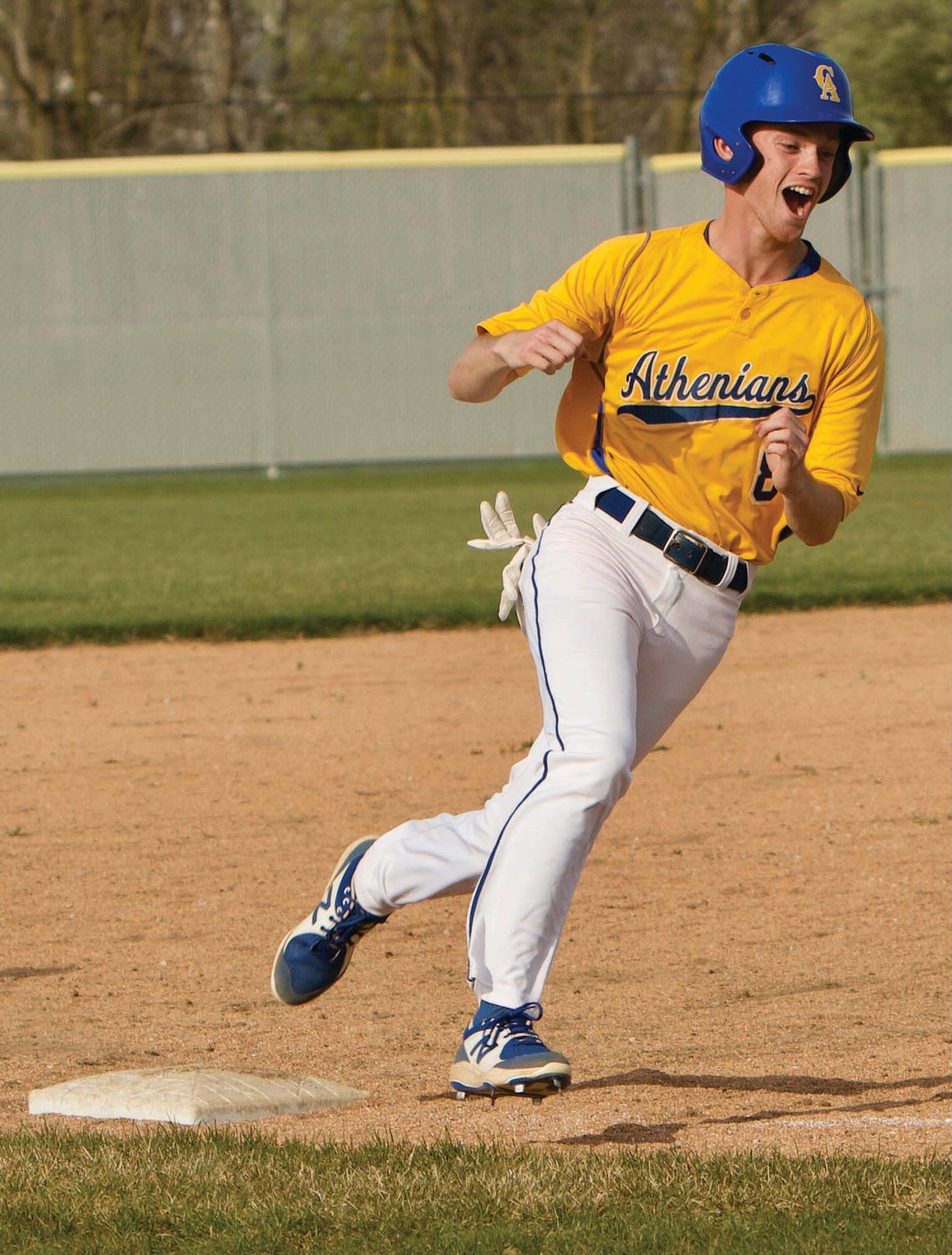 Crawfordsville's Andrew Martin pumps his fist as he rounds the bases earlier this season.