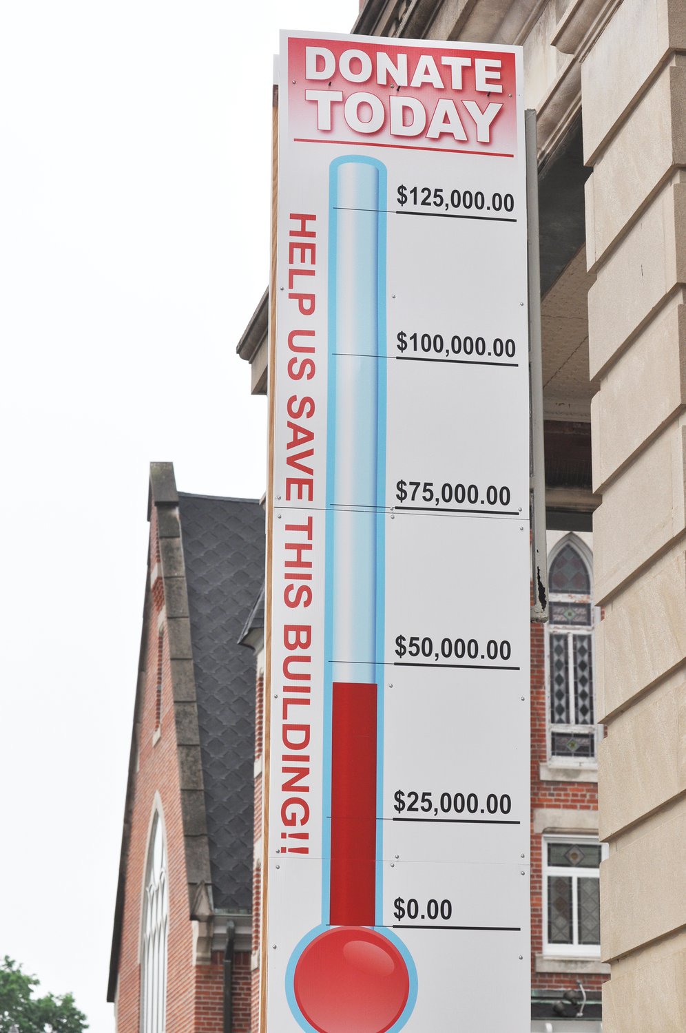 A thermometer outside the Masonic Cornerstone Grand Hall and Event Center tracks the progress of fundraising for the building