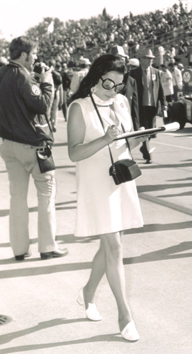 Crawfordsville native Bettie Cadou walks on the track at the Indianapolis Motor Speedway. Cadou was the first female journalist to receive a silver badge and gain access to Gasoline Alley at IMS in 1971.