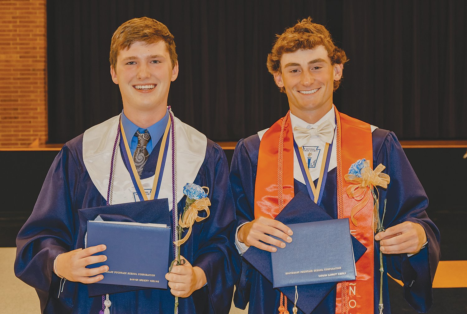 Class of 2021 salutatorian Sawyer Keeling and valedictorian Carson Eberly pose after receiving their diplomas Friday.