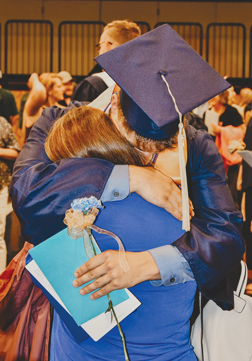 Seth Gayler hugs his mother, Toni, after receiving his diploma Friday from Fountain Central High School.