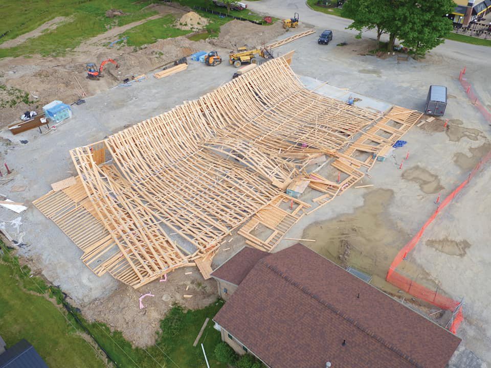 The collapse of the construction on the Crawfordsville Family Vet offices is seen from a drone Monday.