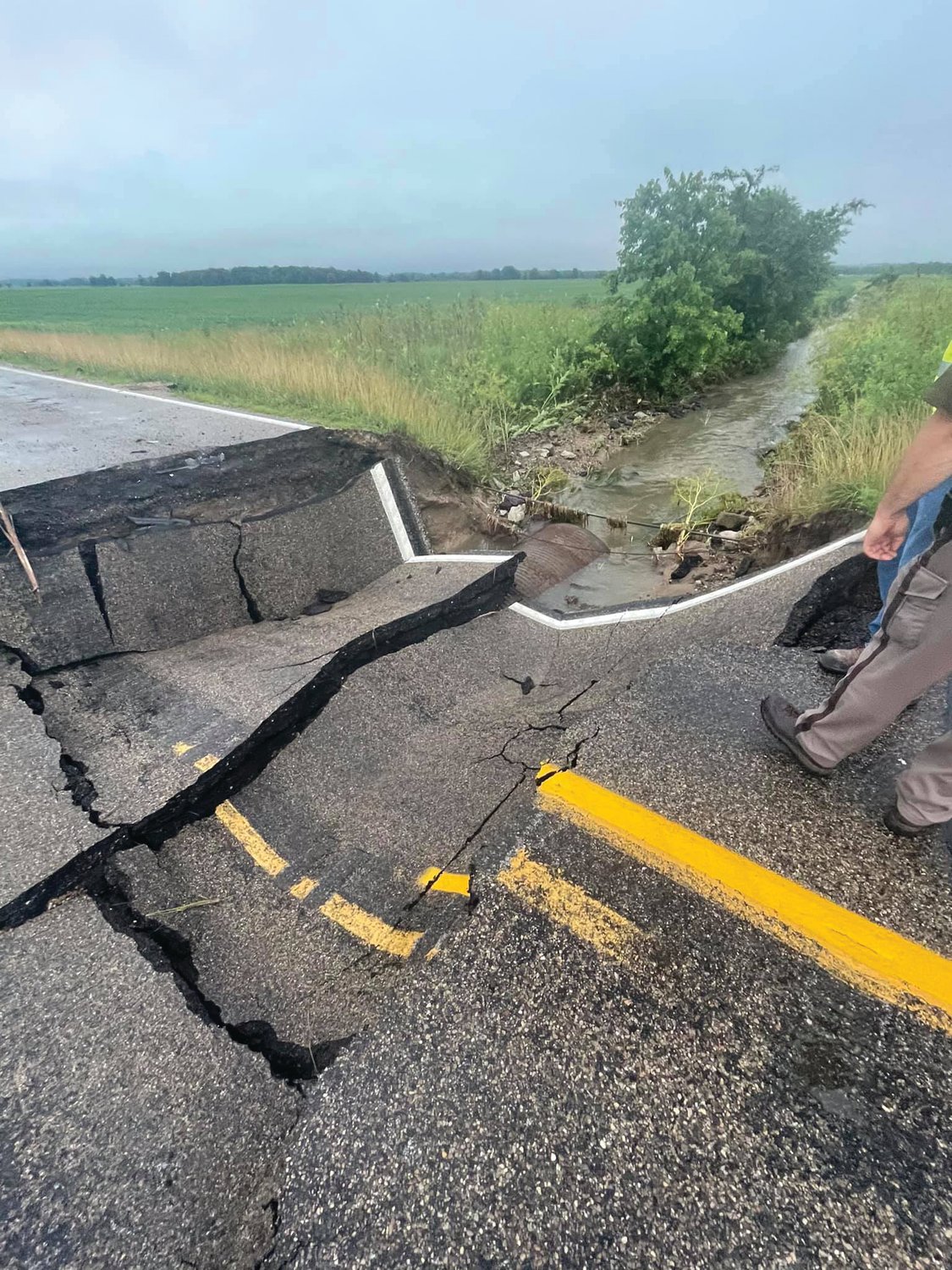 A photo from the Indiana Department of Transportation Thursday shows a collapsed road on State Road 32 West between Sugar Mill Lake Road and Crooked Road in Fountain County. Flash flooding from heavy rainfall overnight disrupted travel in the southern part of the county.