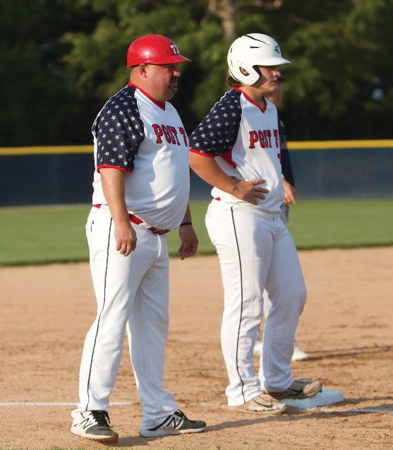 North Montgomery’s Jacob Braun stands with Post 72 coach Kyle Proctor at third base on Wednesday night at North Montgomery. The recent Charger grad scored two runs and hit a solo home run in a 9-1 Post 72 win over Lafayette Post 11.