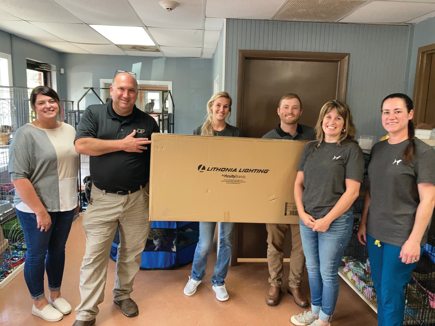 Acuity Brands Lighting donated lights to the Animal Welfare League for its lobby and office renovation. Pictured from left are Carrie Stiff, Acuity human resources manager; Brian Horsting, Acuity focus factory manager; Rachel Lumkes, AWL manager; Nick Sommer, Acuity controller; Misha Anderson, AWL director; and Nickee Sillery, AWL medical coordinator.