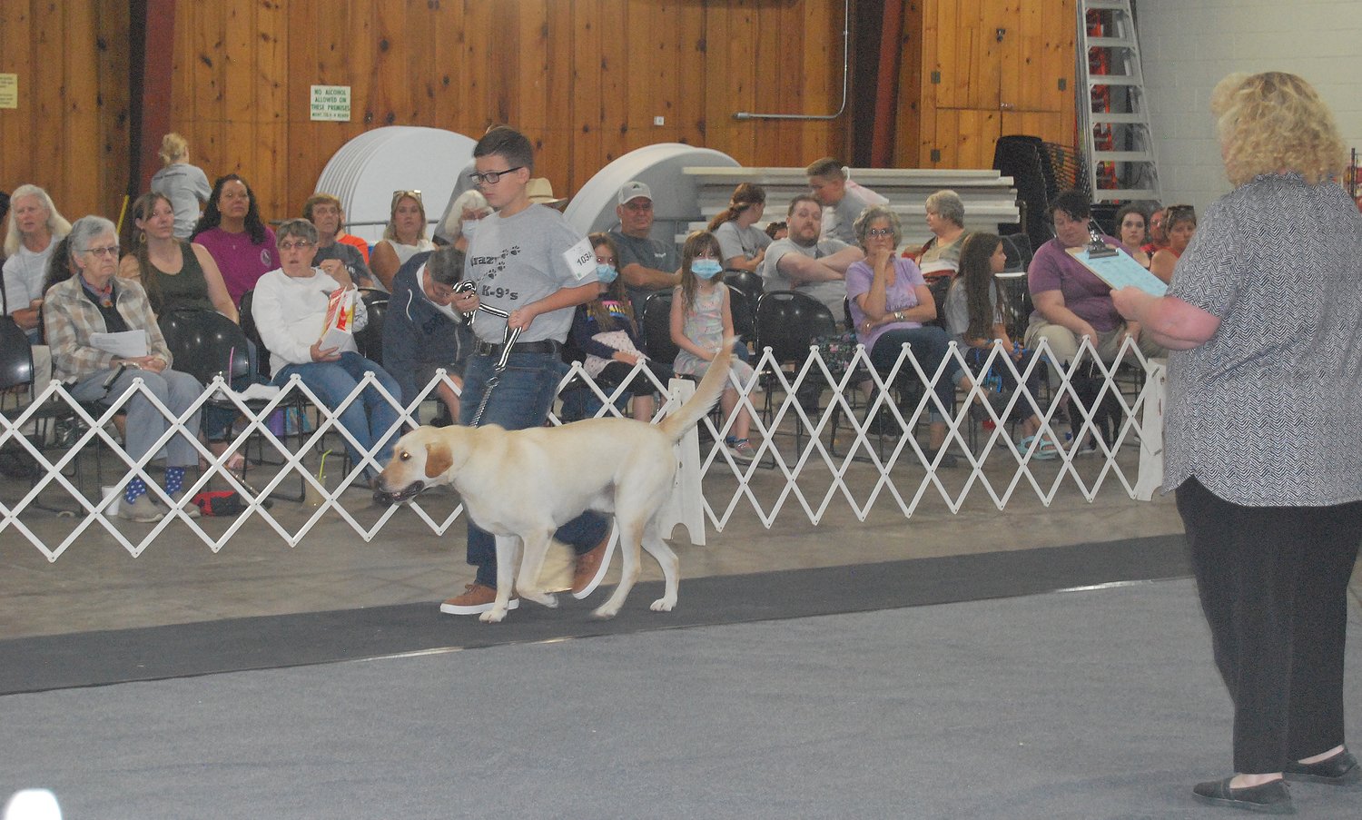 Benjamin Curule and his dog, Shadow, are judged at Tuesday’s dog show.