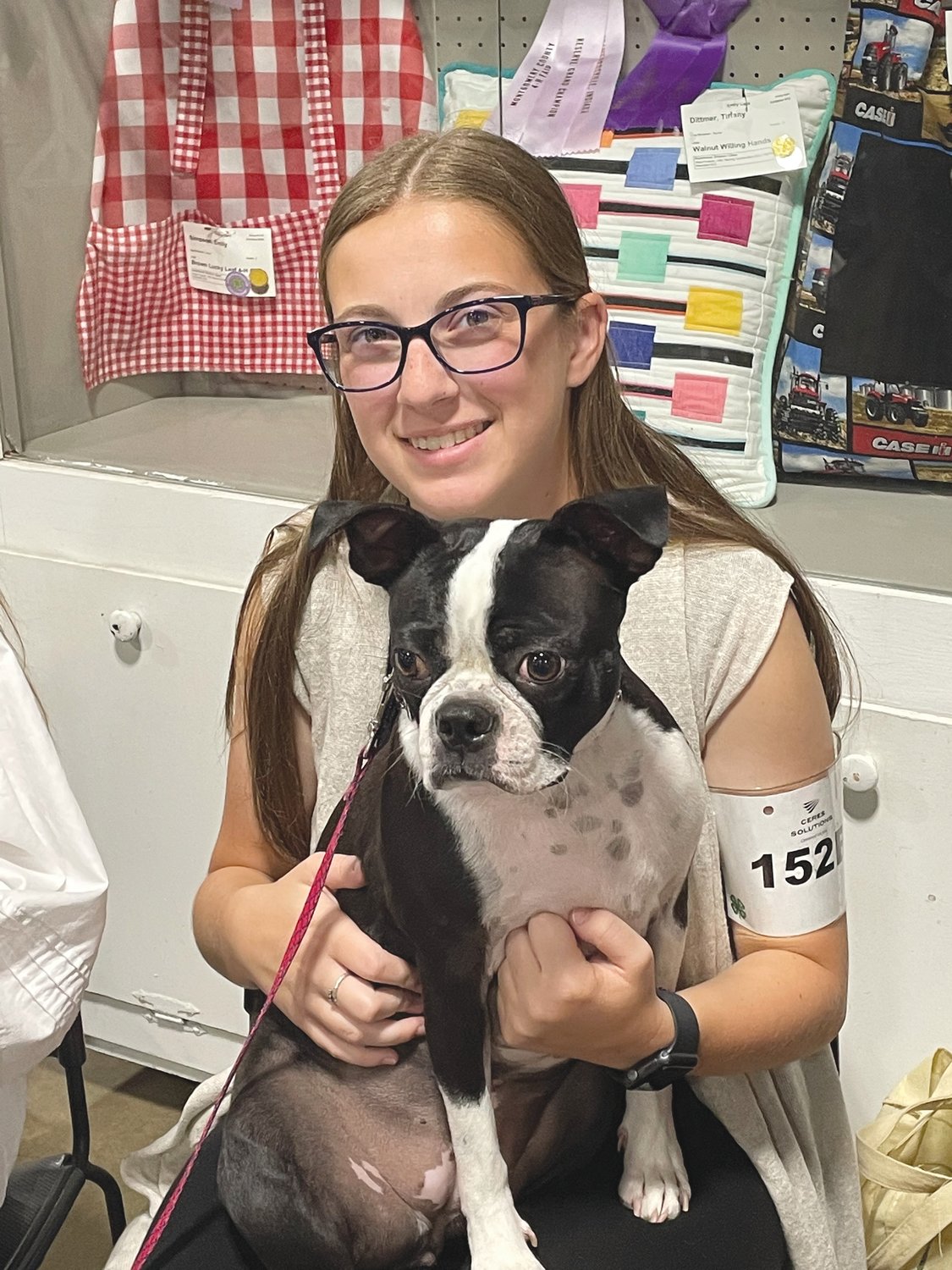 Cailin Phillips shows Bristol, a Boston Terrier, Tuesday at the Montgomery County 4-H Fair.