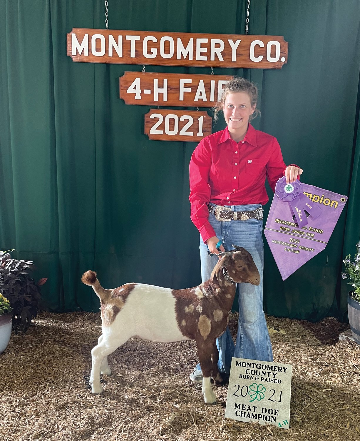 Bailey Barker stands with her grand champion full blood boer junior doe at the Montgomery County 4-H Fair. The animal was also named Montgomery County Born and Raised Meat Doe Champion.