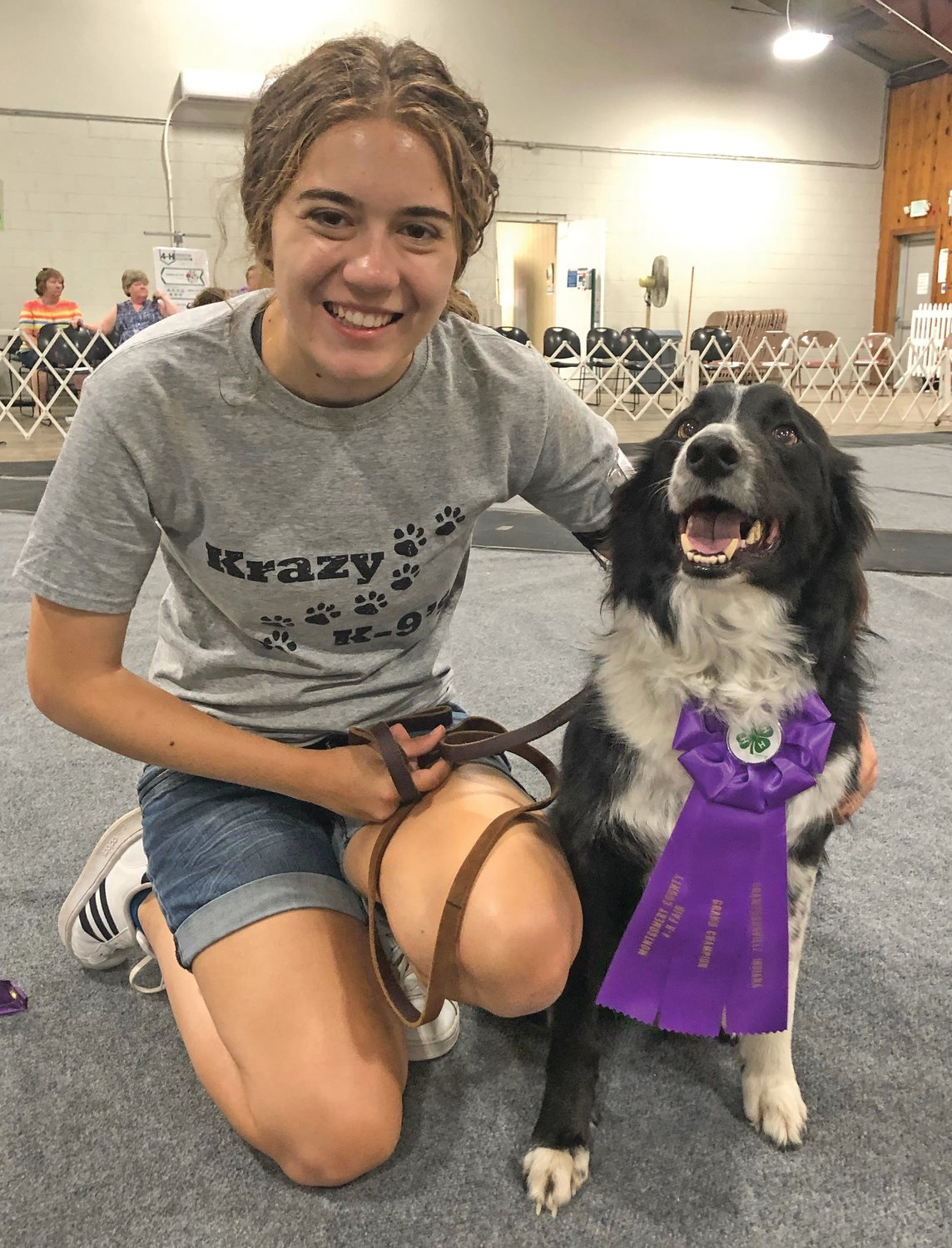 Lauren Tricker with her border collie Max after winning grand champion for obedience in the dog show at the Montgomery County 4-H Fair.