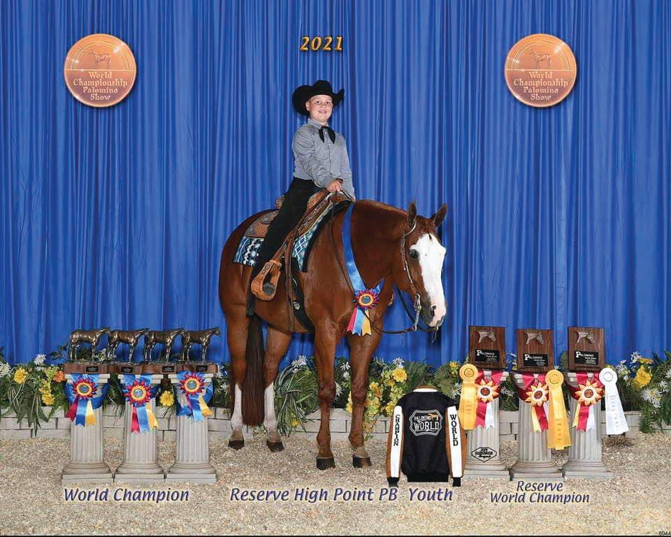Creek Plemons earns the world champion title with his horse Dash at the Palomino World Show.