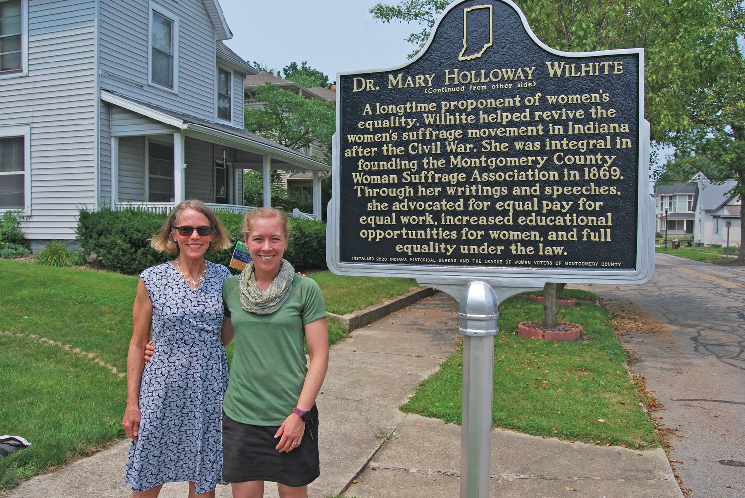 Joan Eaton, left, and her daughter, Claire Gibson, stand next to the historical marker for Dr. Mary Holloway Wilhite in Crawfordsville. Eaton and Gibson are descendants of Wilhite.