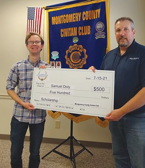 Sam Doty, left, receives the first-ever Montgomery County Civitan Club scholarship.
