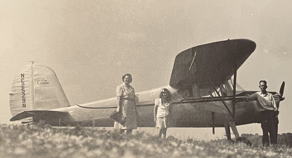 Sue Carroll, middle, stands with Earl Sutherlin, right and friend, left, after flying to Indianapolis in 1947.