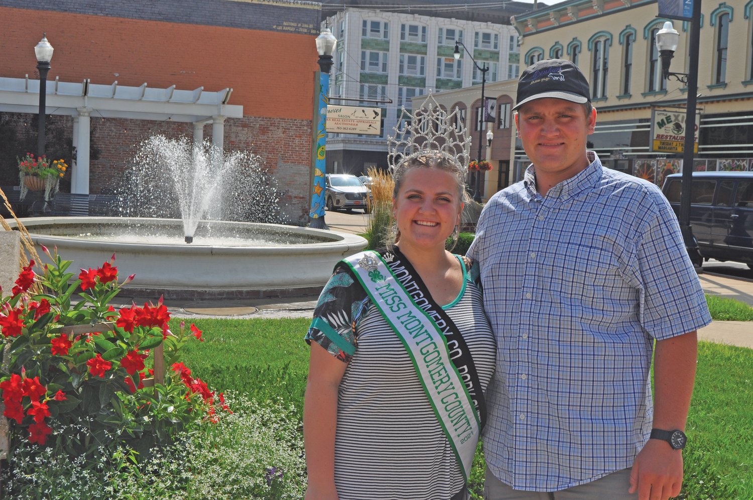 Twin siblings Morgan, left, and Colton Meadows at Marie Canine Plaza in downtown Crawfordsville. Morgan is the reigning Miss Montgomery County and Colton was named Supreme Showman at this year’s 4-H fair.