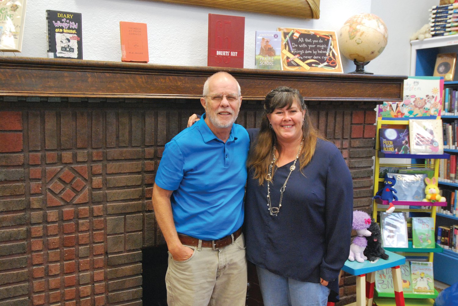Rick Payne, outgoing director, and Christy Roark, new director, stand in the children’s area of Waveland-Brown Township Public Library. Payne retired this week after more than 10 years overseeing the library.