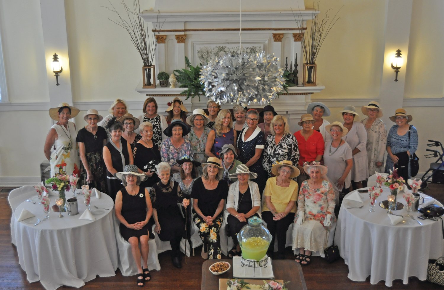 Members of the Flower Lovers Garden Club gather for a 100th anniversary celebration at the Masonic Cornerstone Grand Hall and Event Center on Wednesday.