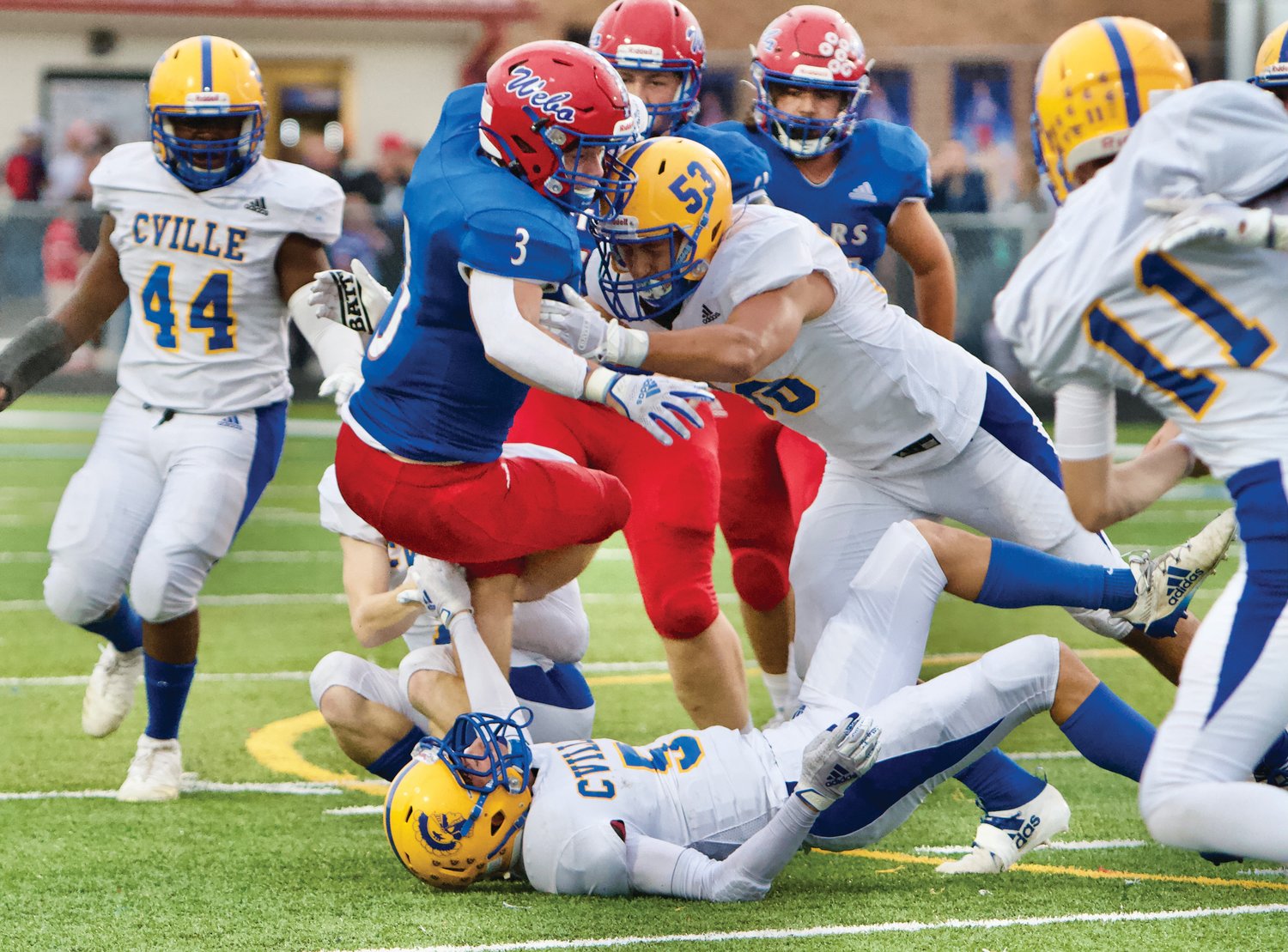 Crawfordsville defense stops Western Boone in the backfield.