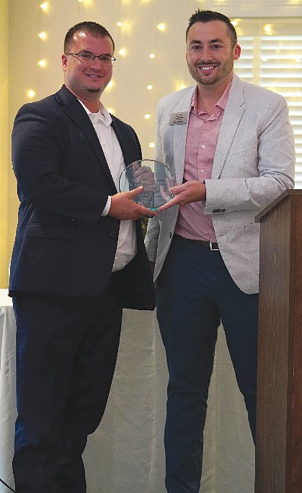 Jim Johnson, Fusion 54, receives the Rising Star: Young Professional of the Year award, presented by 2020 Star, Cody Hargis of HHSB. Hargis was the inaugural recipient of the award.