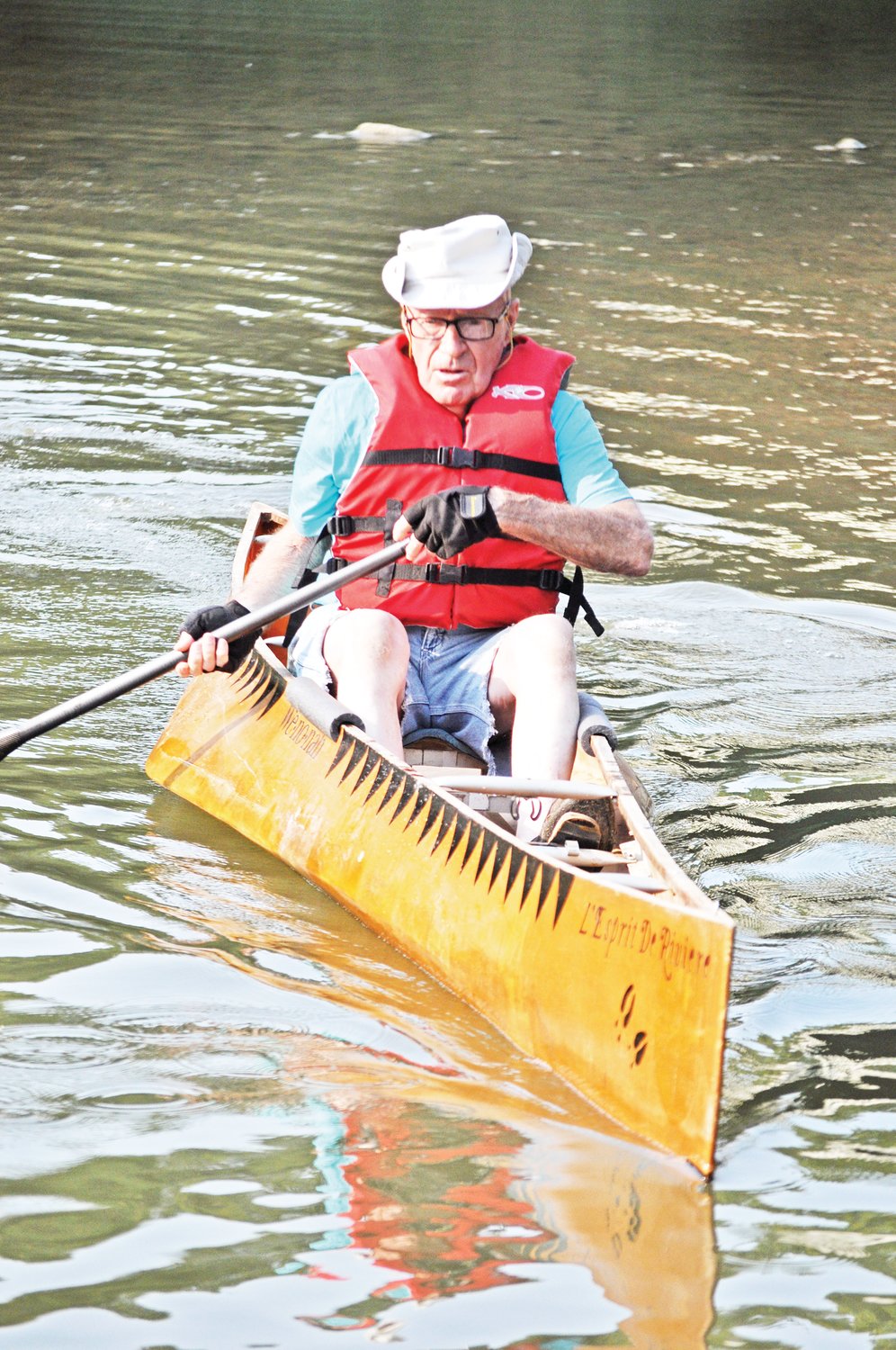 Bob Stwalley comes in after paddling through the old lowhead dam site on Sugar Creek on Monday.