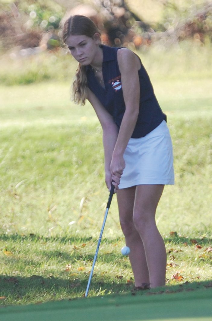 North Montgomery's Shayna Ratcliff chips on No. 9.
