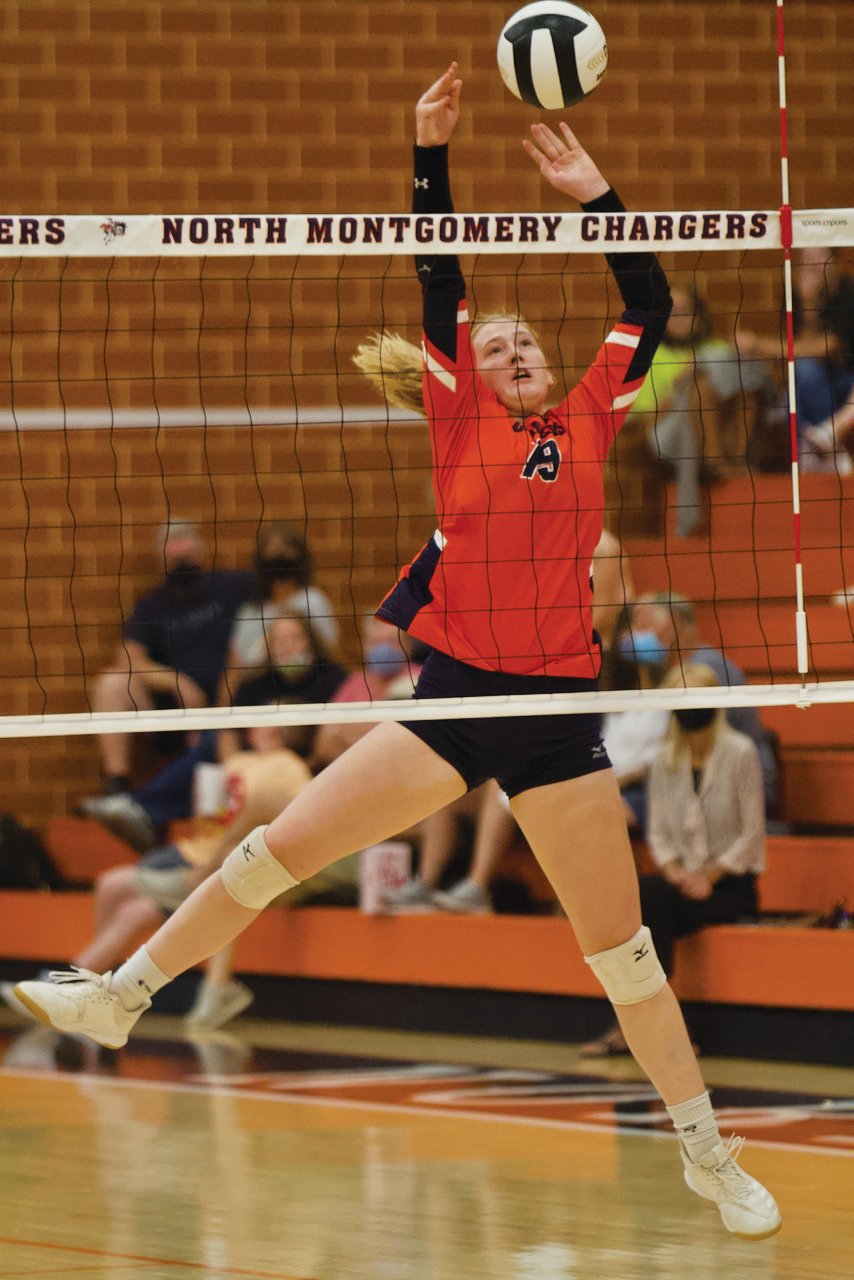 North Montgomery's Trinity Schroeder plays a shot at the  net.