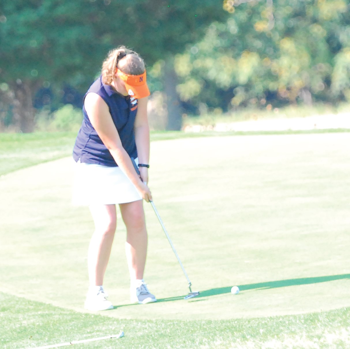North Montgomery's Morgan Swick putts at the sectional.
