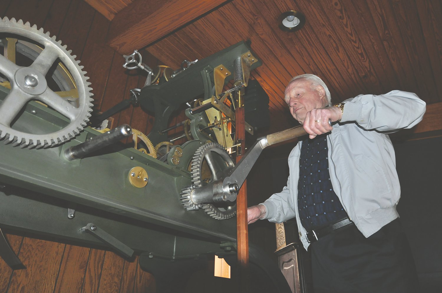 Hubert Danzebrink winds the old Montgomery County Courthouse clock in 2018. Danzebrink, who rebuilt the clock, died Sunday.