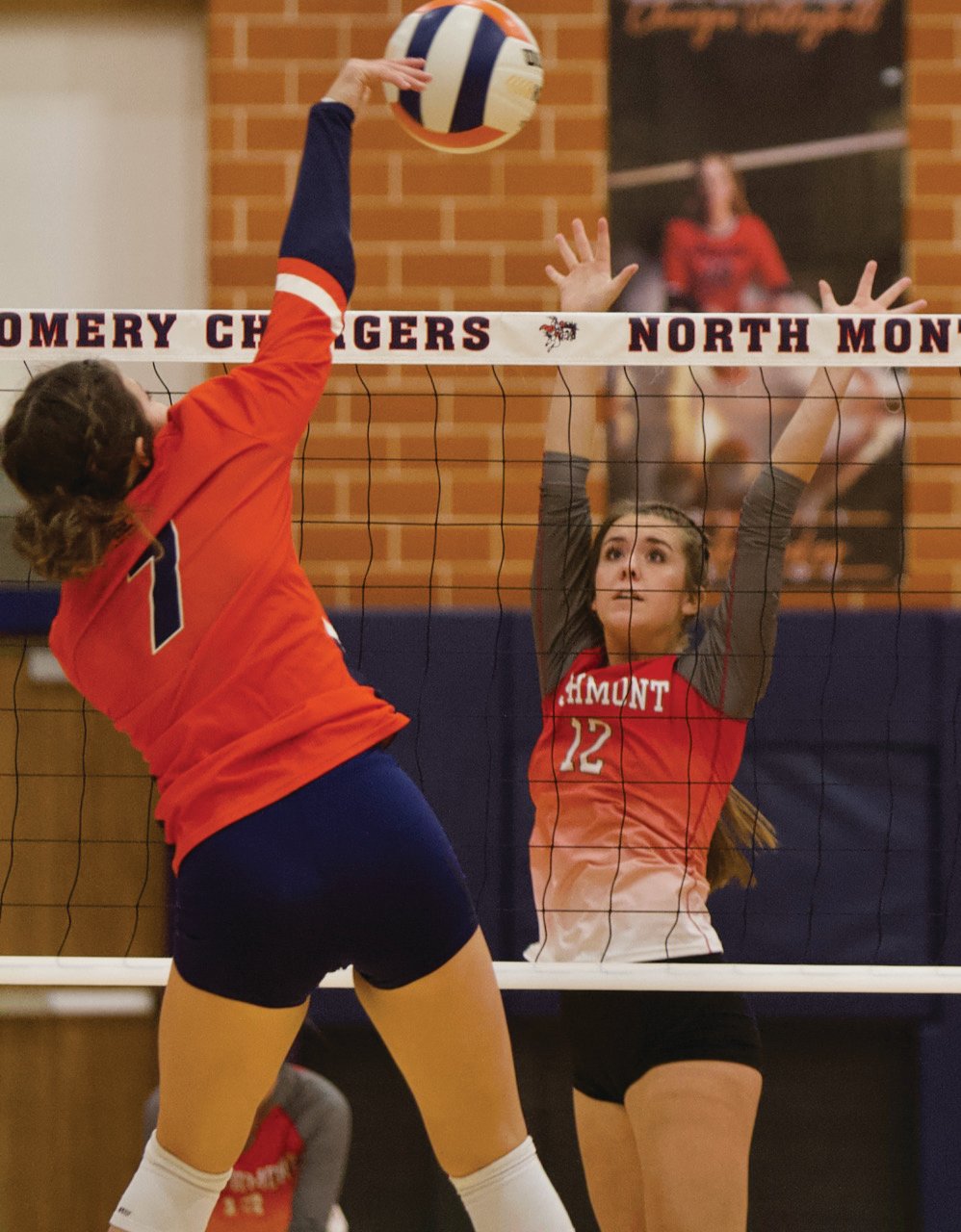 North Montgomery senior Ashlynn Anderson spikes the ball upon the Southmont defense.