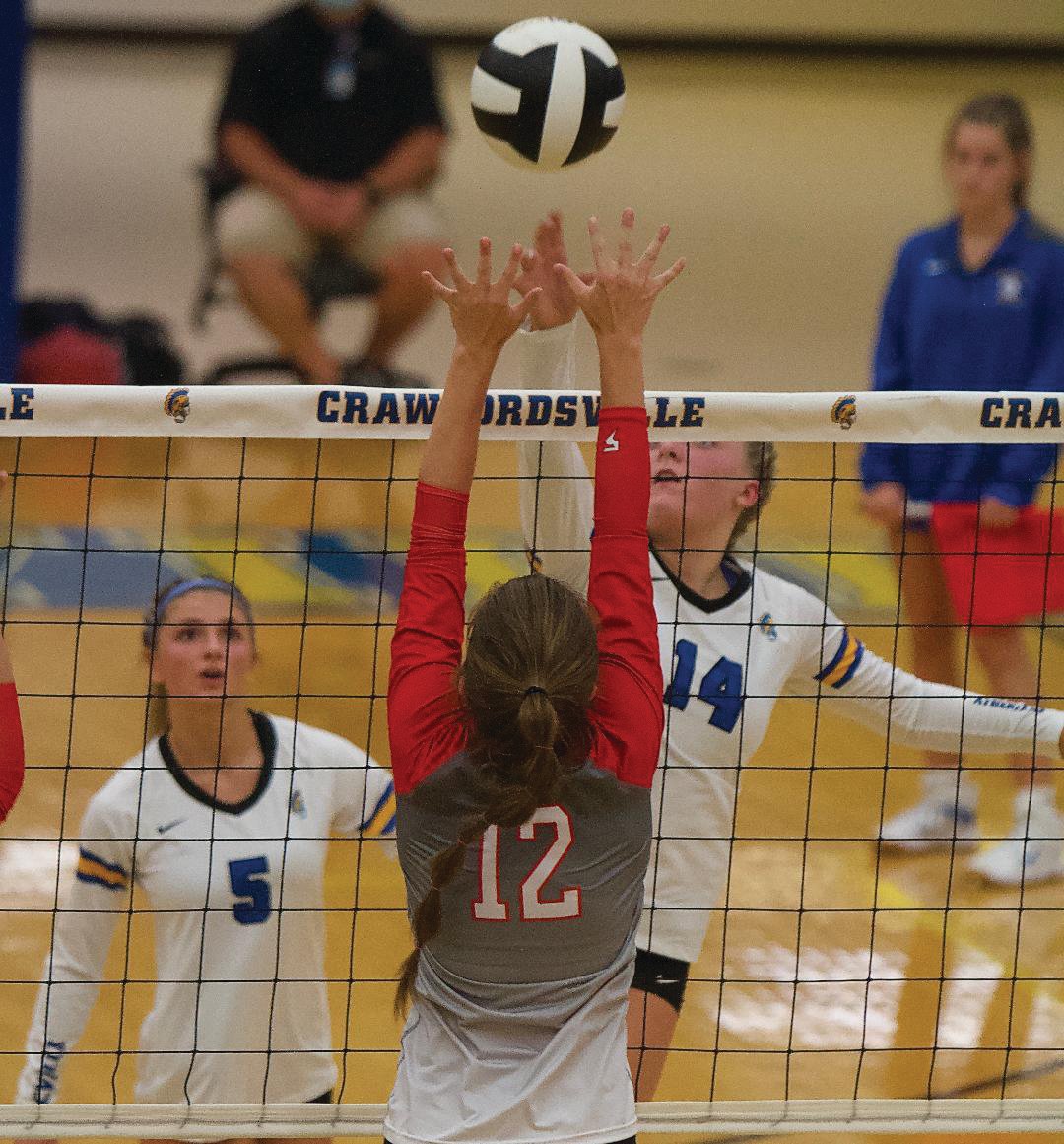 Crawfordsville’s Macy Bruton spikes a ball over the net against Southmont on Monday.