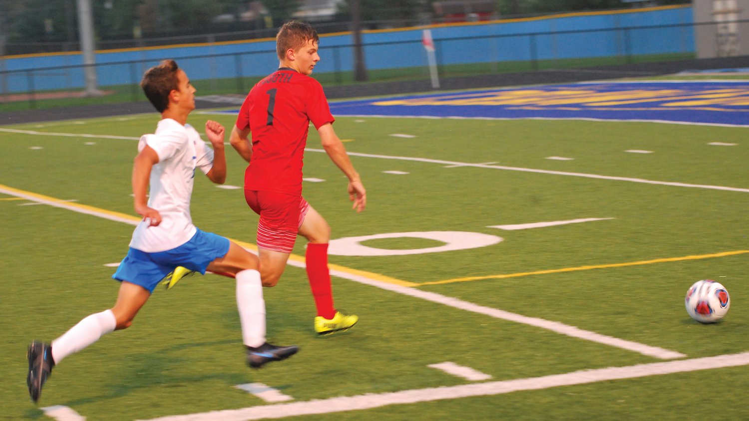 Southmont defender Silas Adams tries to beat a Frankfort striker to the ball on Monday night during the sectional at Crawfordsville.