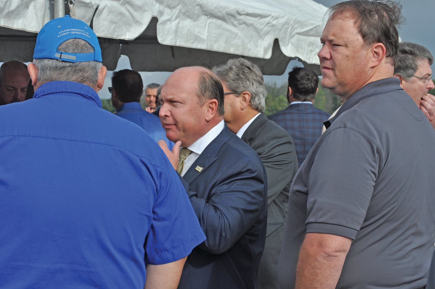 Steve McLaughlin, center, Crawfordsville Community School Corp. board president and Scott Bowling, superintendent of Crawfordsville schools, speak with Scott Hesler, Crawfordsville Street Department superintendent, at a groundbreaking ceremony for the Tempur Sealy plant on Thursday.