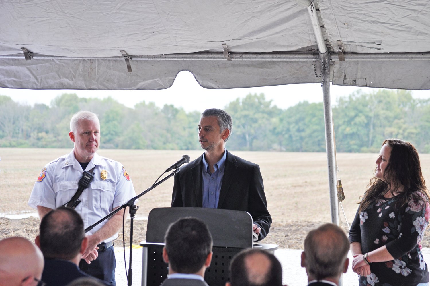 Alex Lupi, center, director of operations for Tempur Sealy International, presents donations to the Crawfordsville Fire Department and women’s addictions residential facility Through the Gate at a groundbreaking ceremony for the Tempur Sealy plant on Thursday. Representing the fire department is Chief Scott Busenbark and representing Through the Gate is founder Janet Covington.