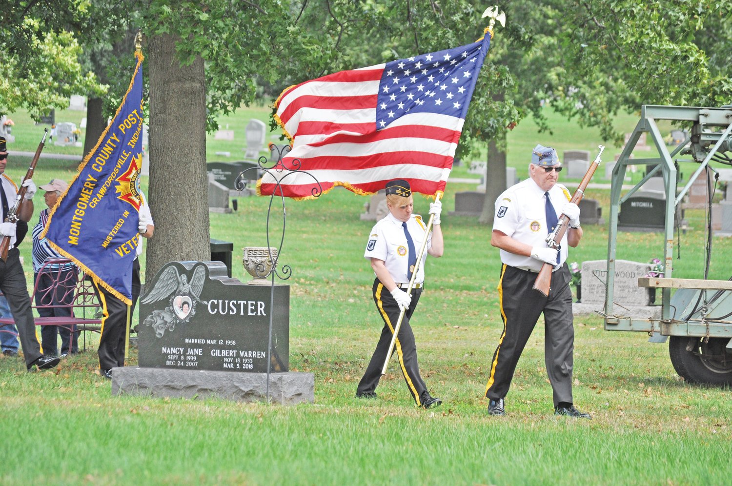 The Byron Cox Post 72 Honor Guard leaves the graveside service for longtime Crawfordsville Fire Chief Dennis Weir at Oak Hill Cemetery North on Monday.