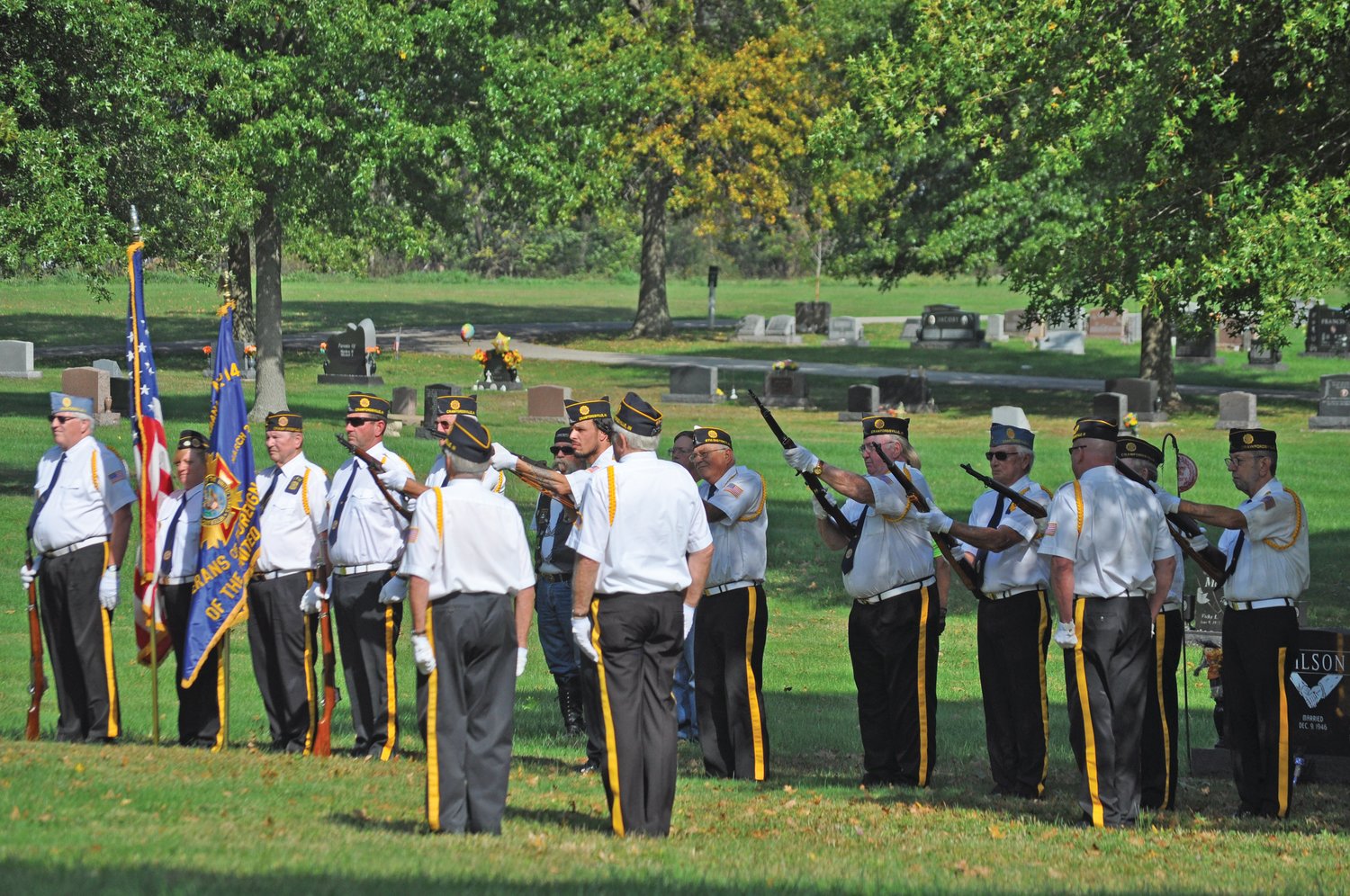 The Byron Cox Post 72 Honor Guard performs a gun salute at the graveside services for longtime Crawfordsville Fire Chief Dennis Weir at Oak Hill Cemetery North on Monday.