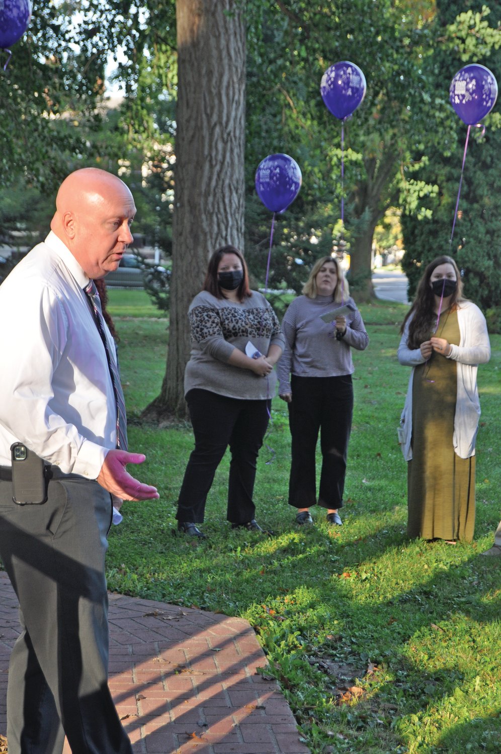 Mayor Todd Barton speaks at a ceremony recognizing Domestic Violence Awareness Month on the Lane Place grounds on Wednesday.